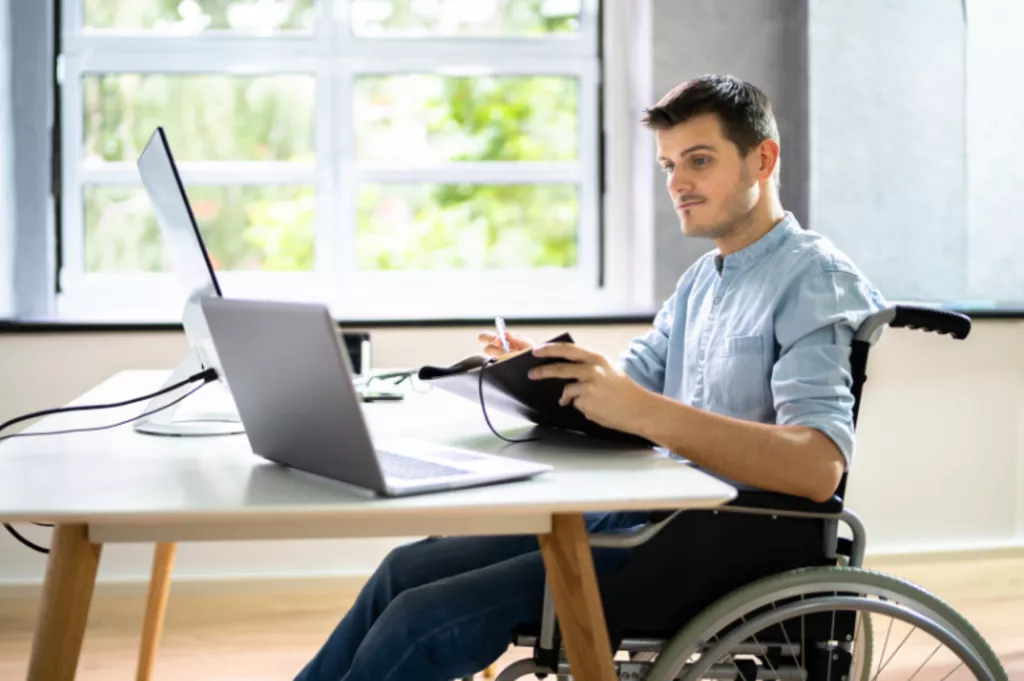 Man in wheelchair working